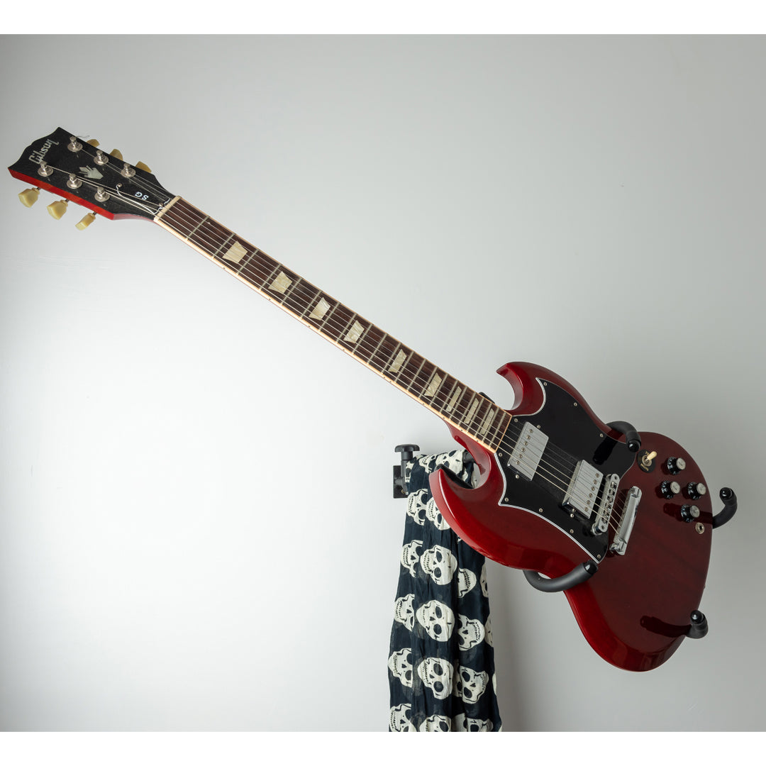 Red electric guitar in a second display orientation on Iron Cage