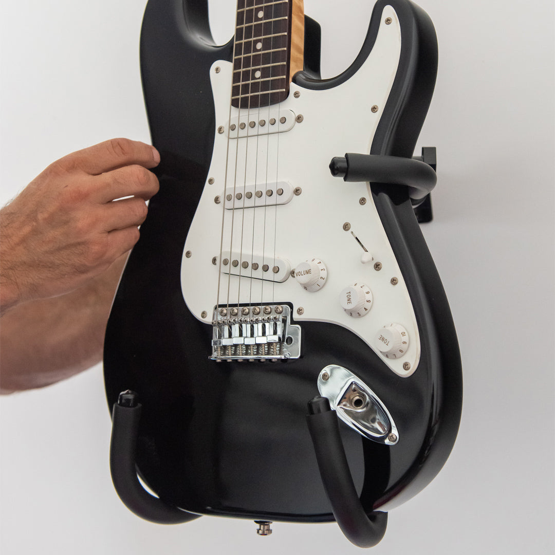 Close view of Iron Cage supporting a black electric guitar